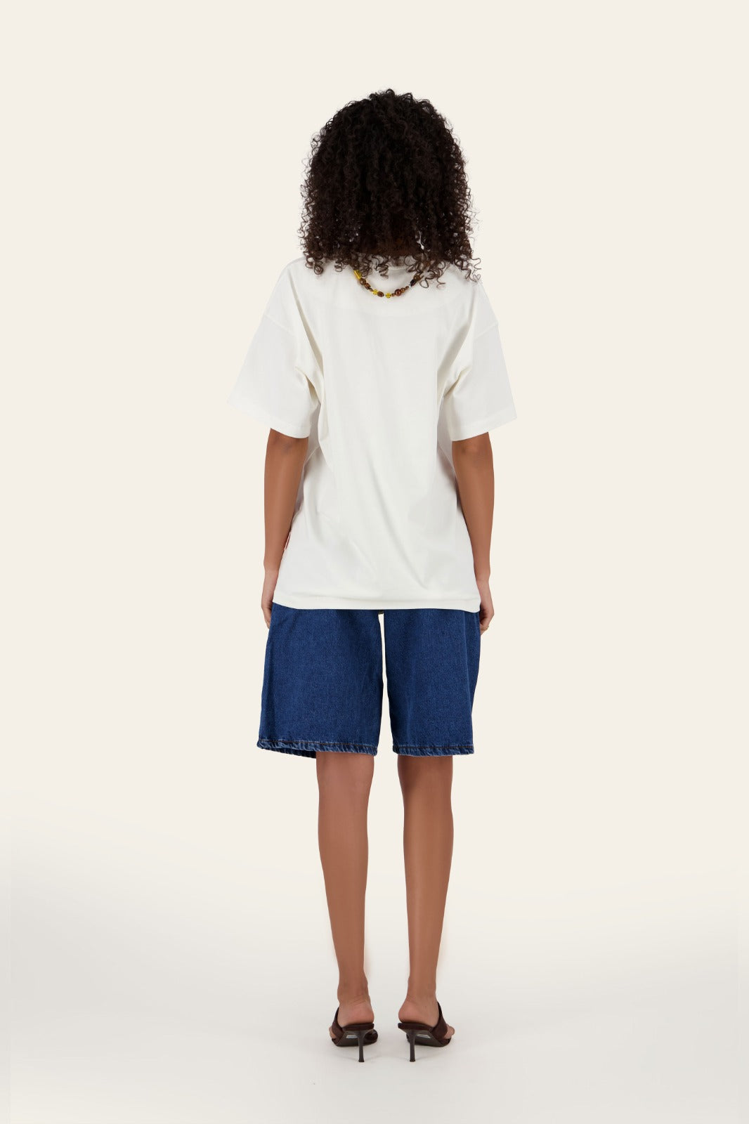 Model wearing Street Jorts blue longline denim shorts with white oversized t-shirt